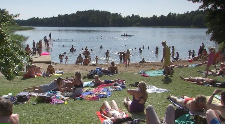 The villagers are sunbathing by the lake.